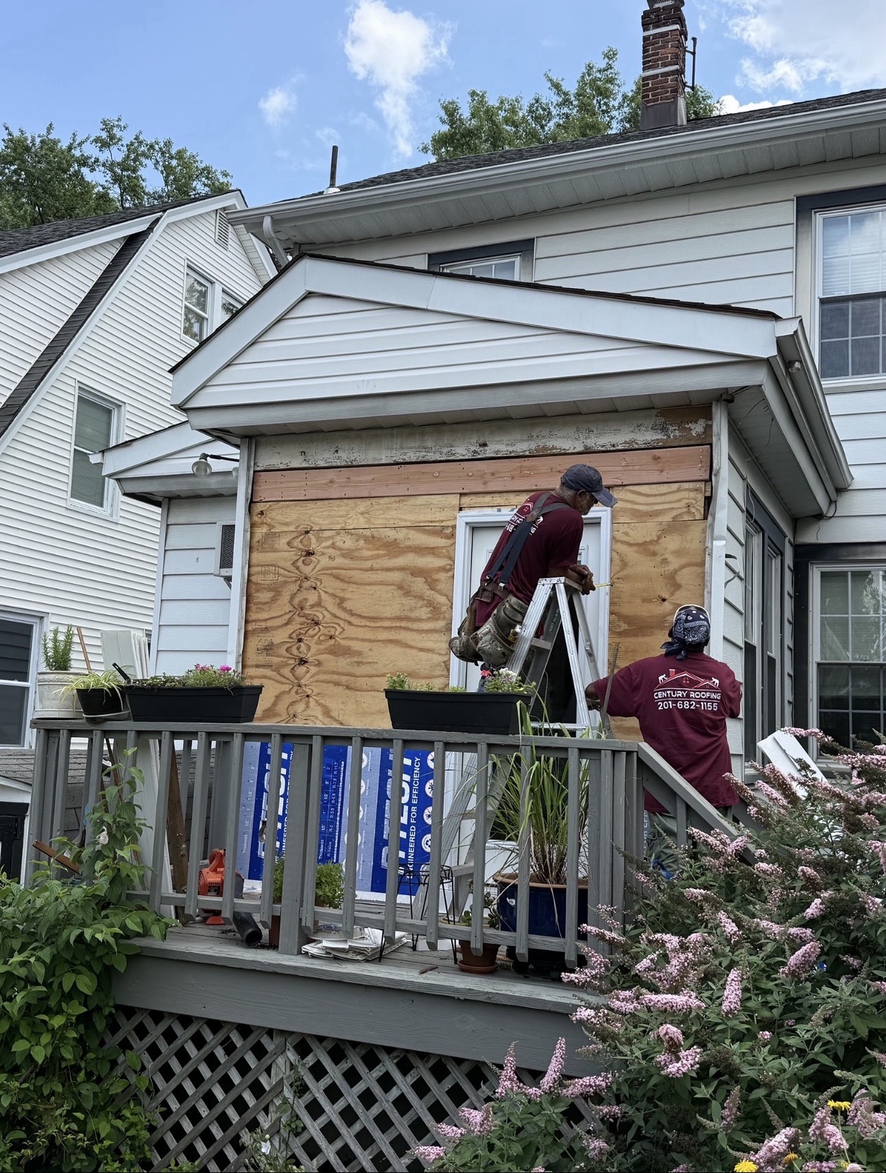 Century Roofing crew replacing exterior siding on a New Jersey home