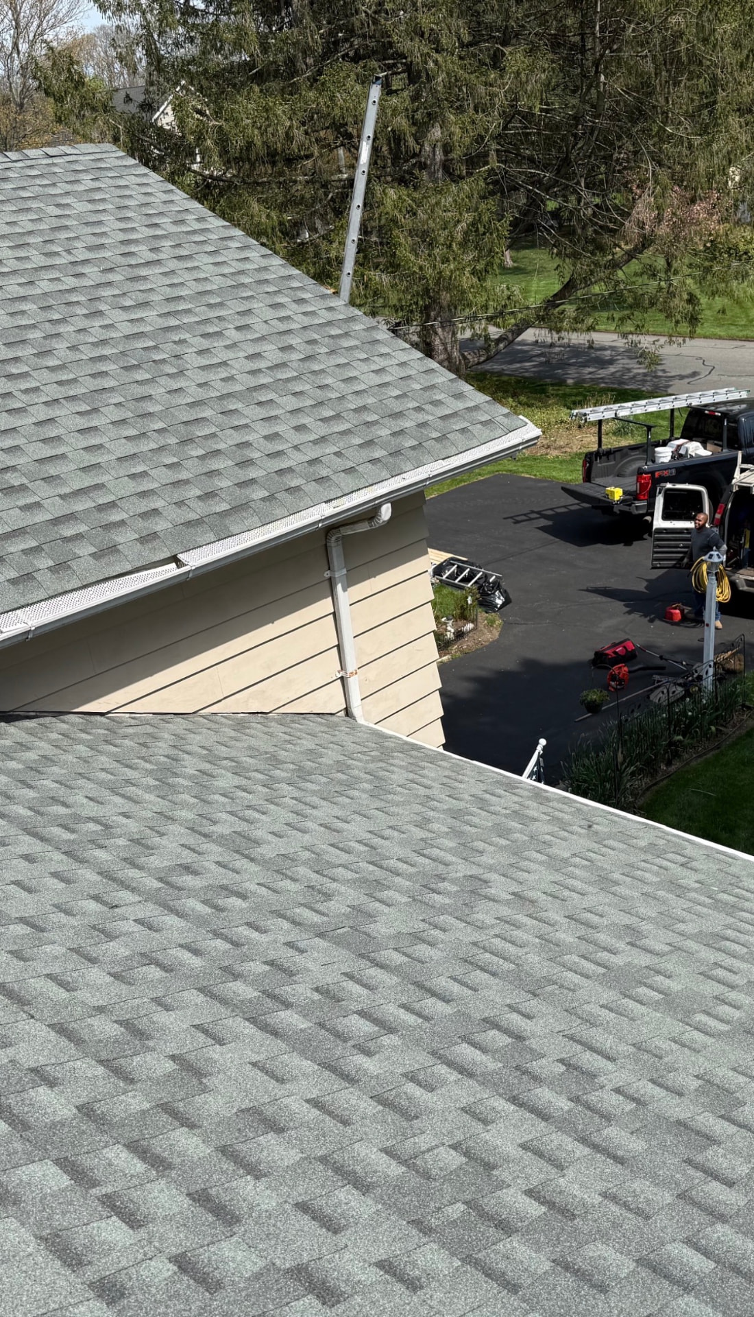 Completed gray architectural shingle roof viewed from above