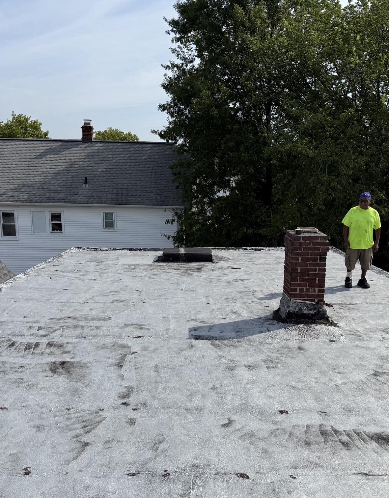 Existing low-slope roof inspected before replacement