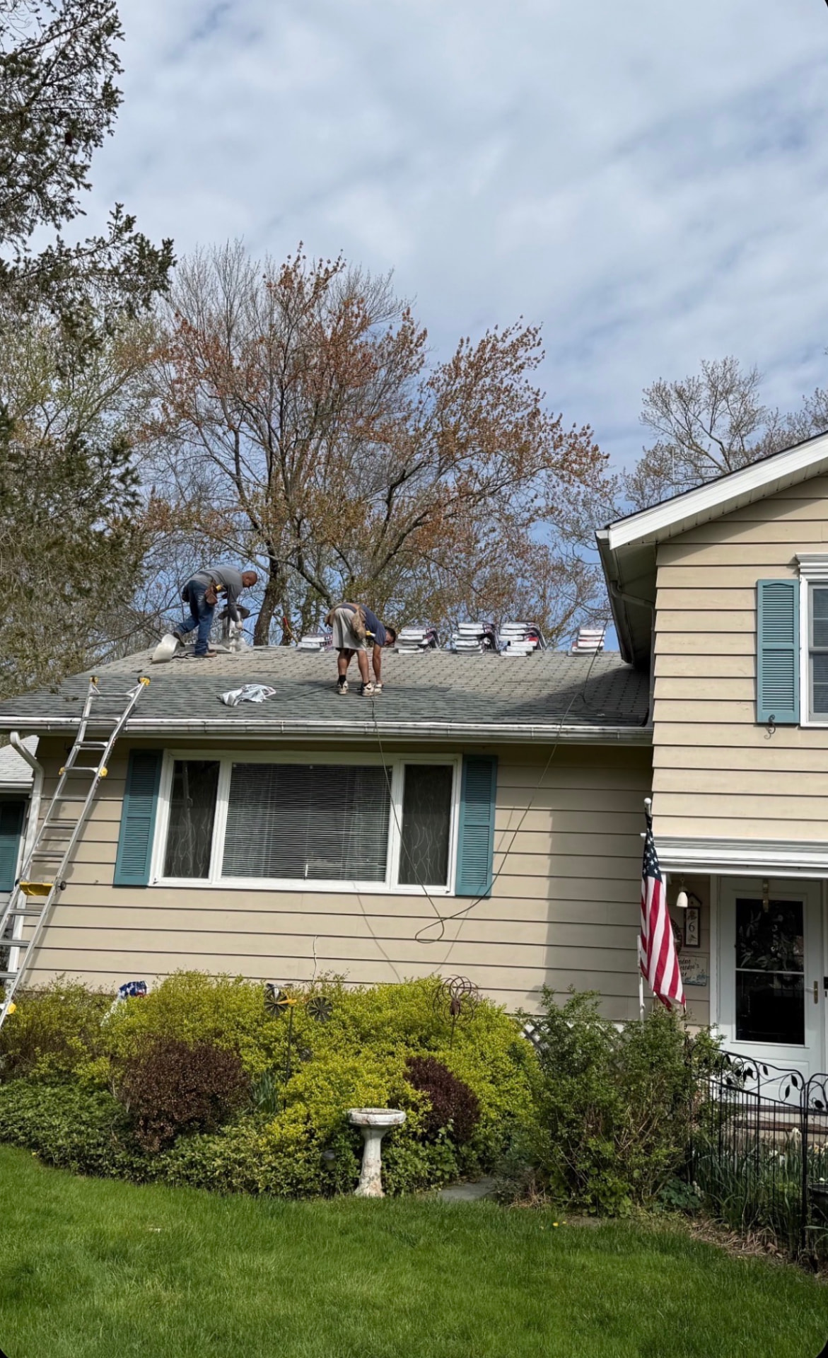 Roofers installing architectural shingles on a New Jersey home
